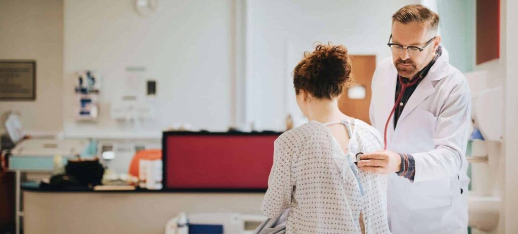 a consult with a doctor and child using health insurance in Spain for expats