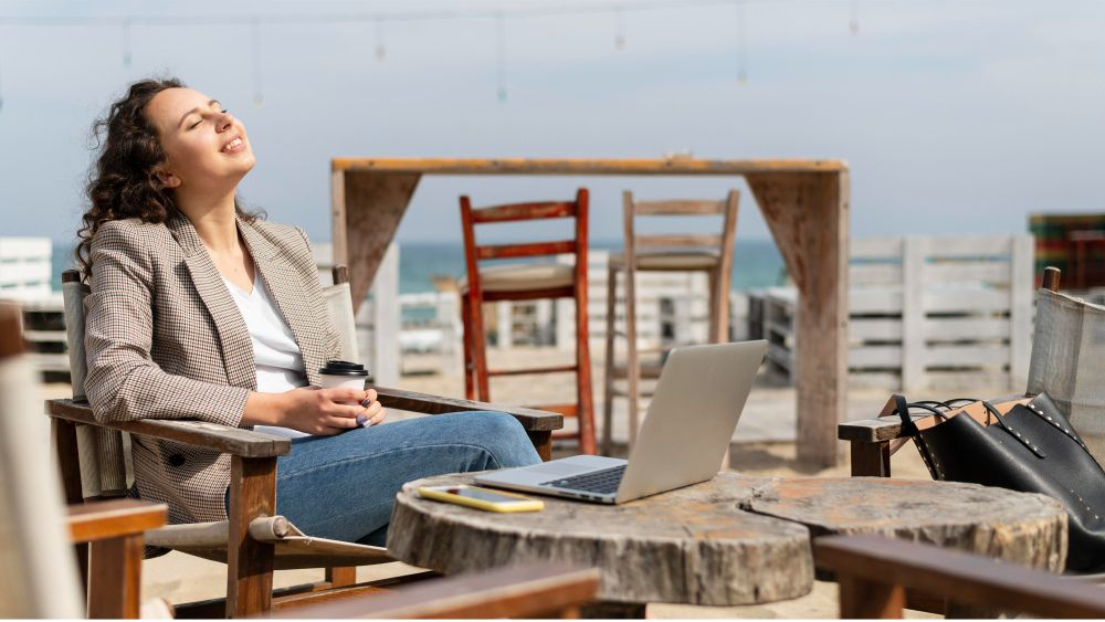 A woman taking the sun on a terrace in Spain with the peace of mind that offers a good insurance guide